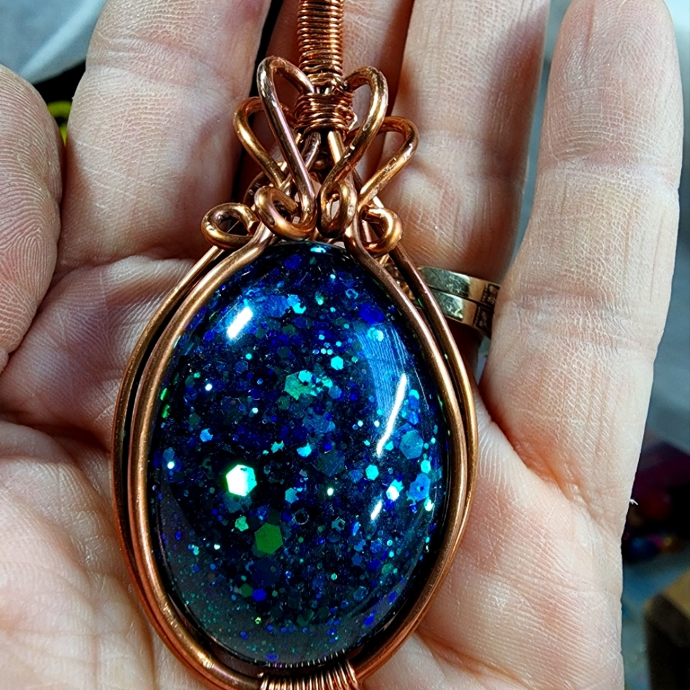 NWOT,Hand crafted wire wrapped, blue sparkle cabochon (Resin) wrapped in Copper.